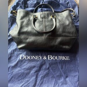 Dooney & Bourke - black leather tote with brass metalwork & red interior.